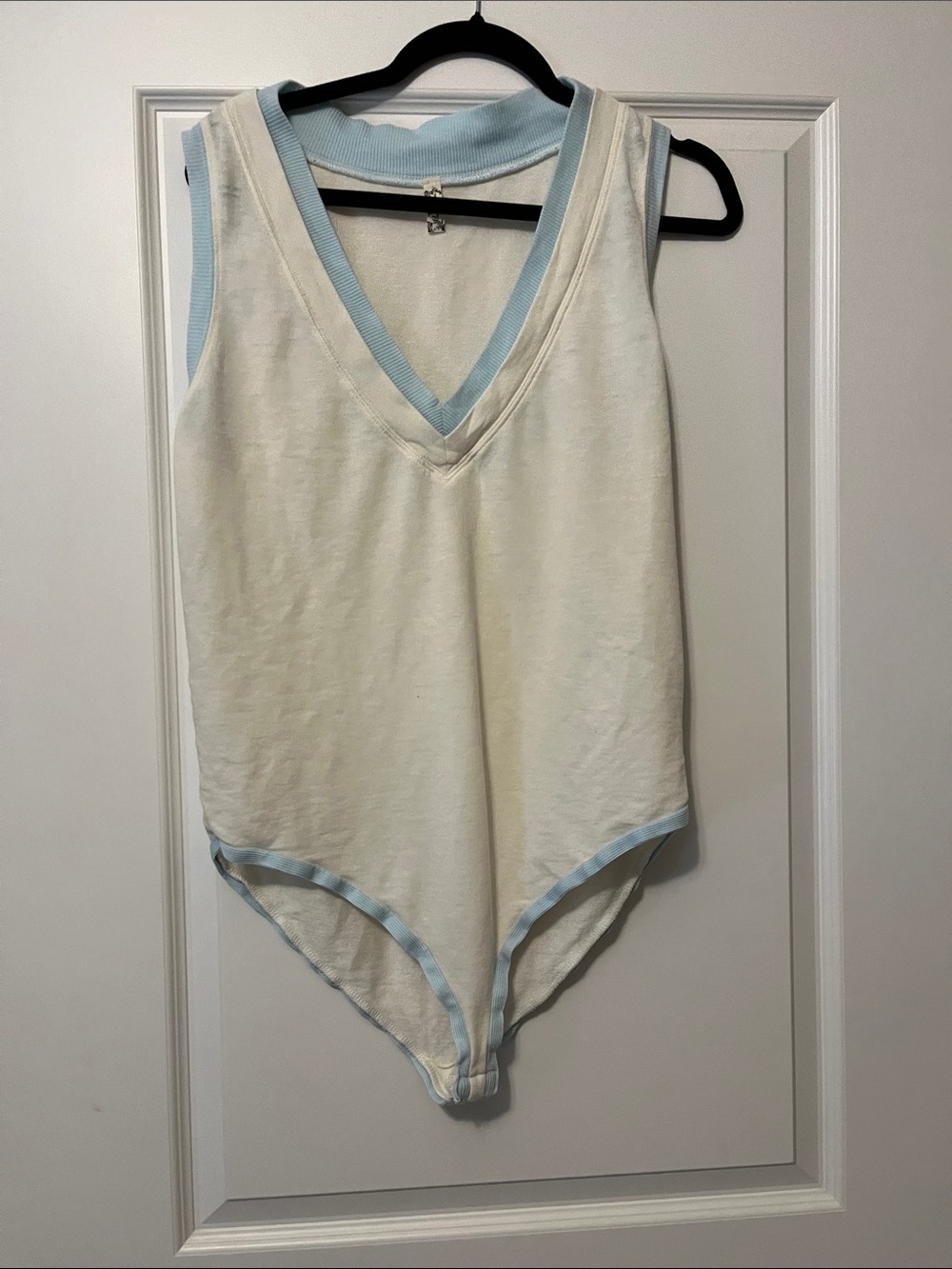 Sleeveless White Bodysuit with Light Blue Trim